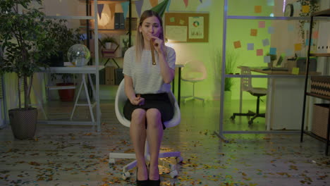 woman celebrating in office