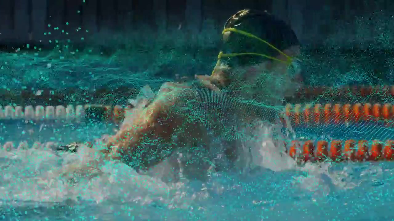 Swimmer breaking surface inhaling driving breaststroke training teal particles accenting lane ropes