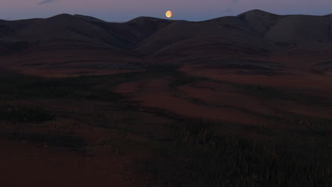 reveals sunset mountain near the arctic circle in the north of yukon territory, canada. tilt-up shot