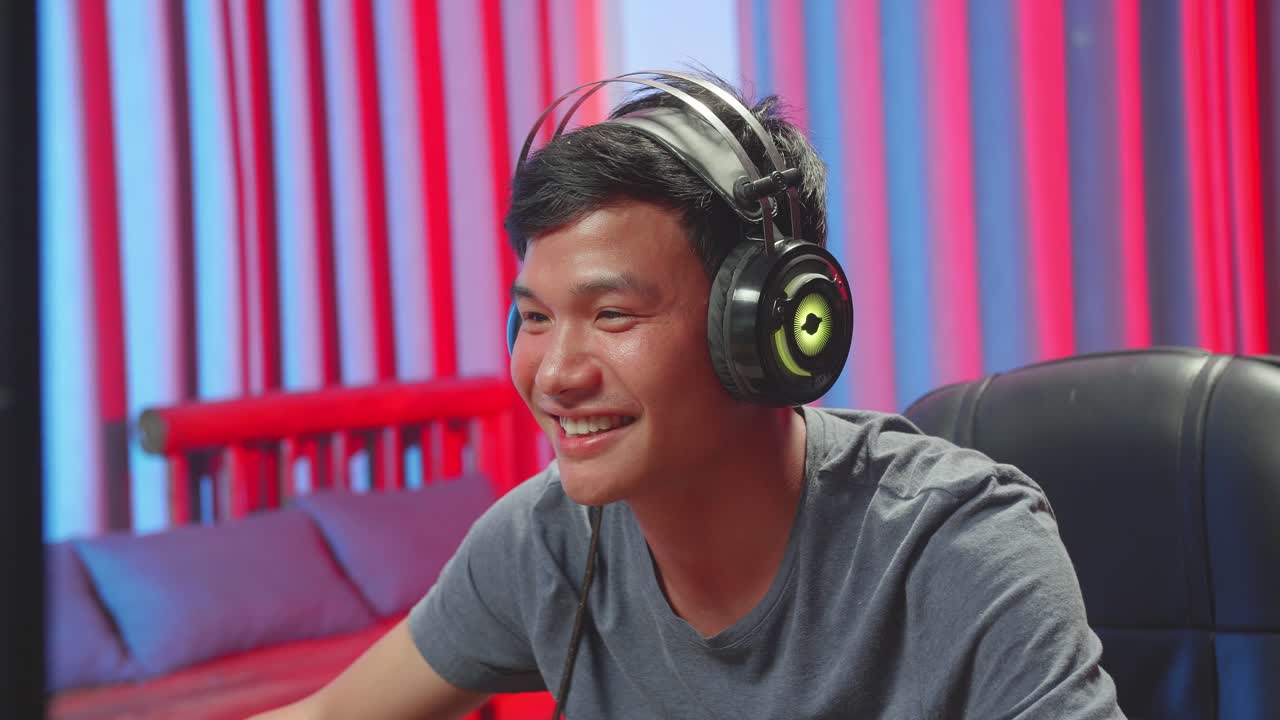 Asian Man Playing Video Game