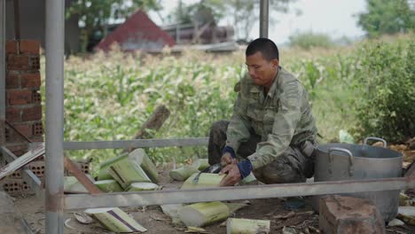 man processing banana stems