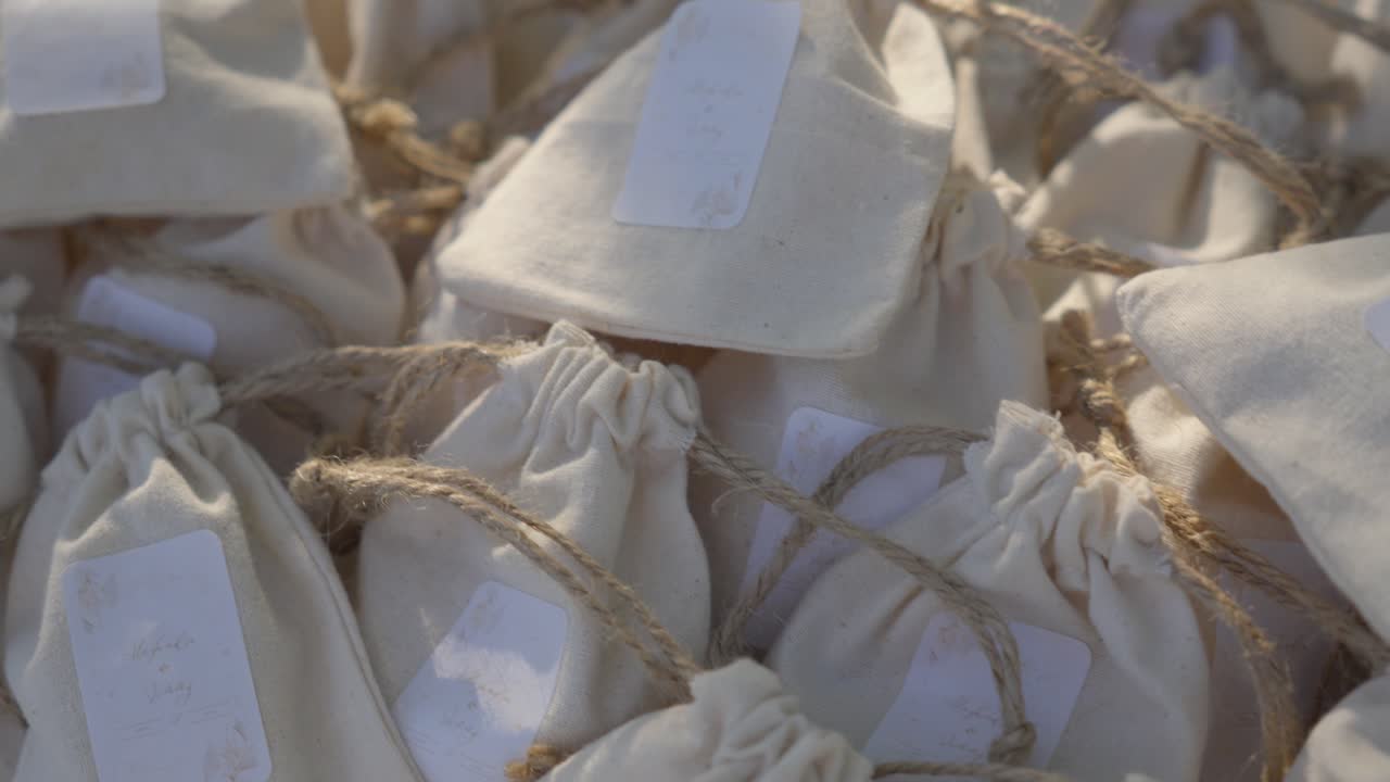 Wedding gifts in small bags at ceremonial party.