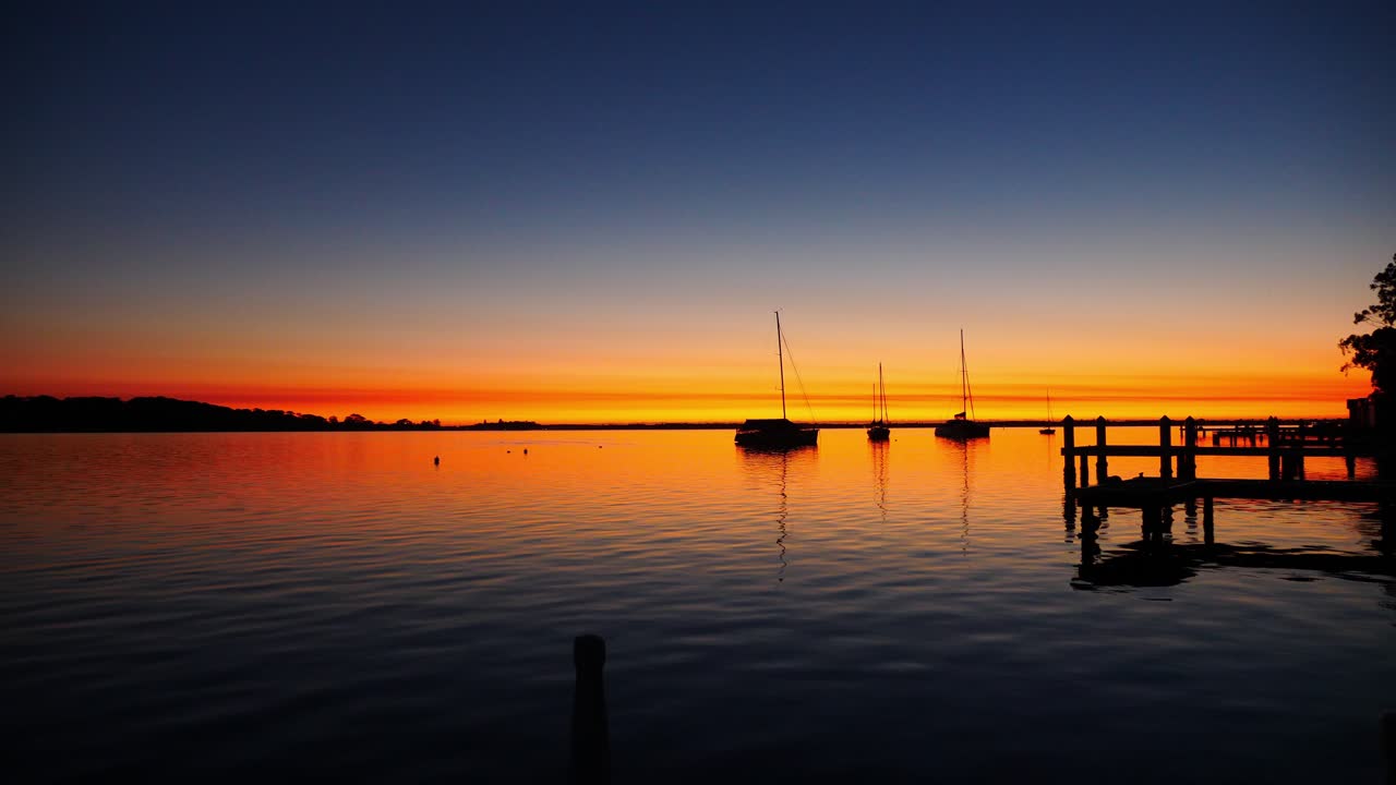 sailing boats and yachts floating on lake macquarie new castle
sunrise sunlight reflection over thje lake