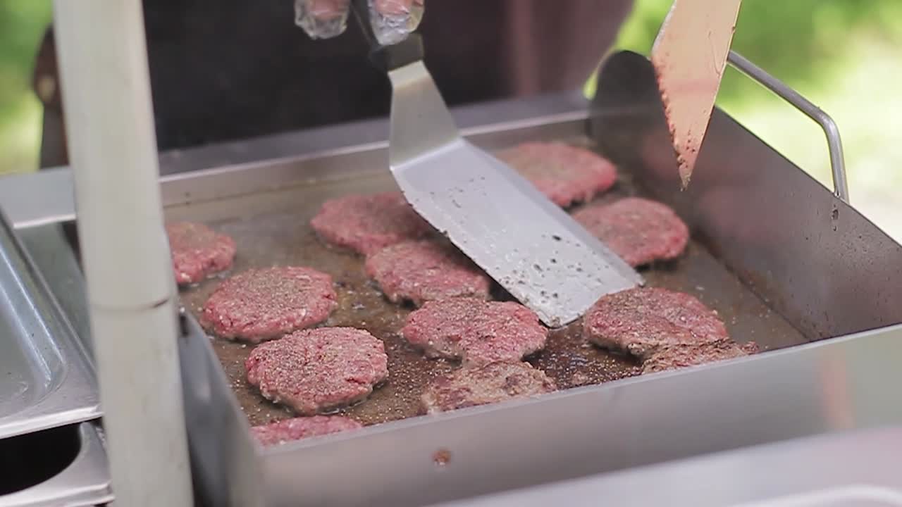 preparation of raw hamburger in the backyard of the house, slow motion, detail view