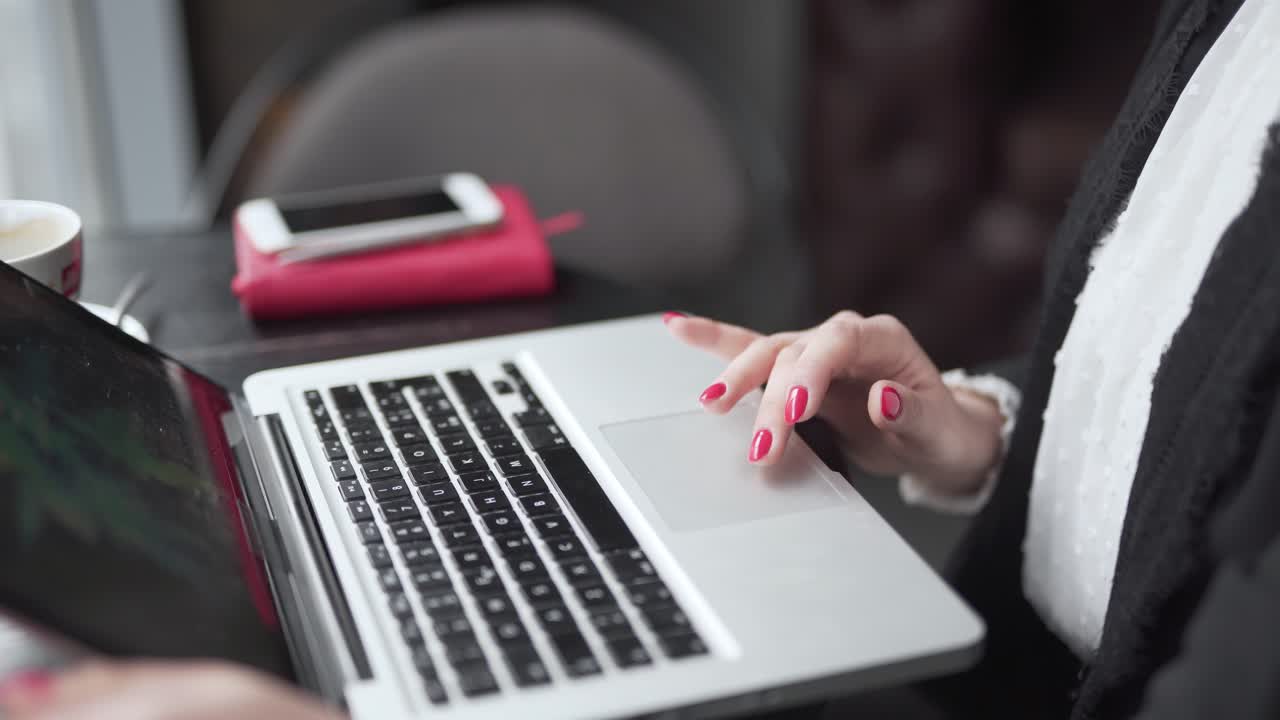 Close up of woman hands working on laptop