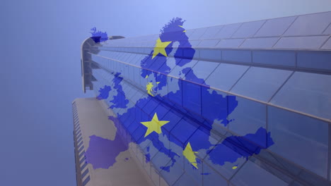 bandera de la ue sobre el mapa de la ue contra el edificio alto