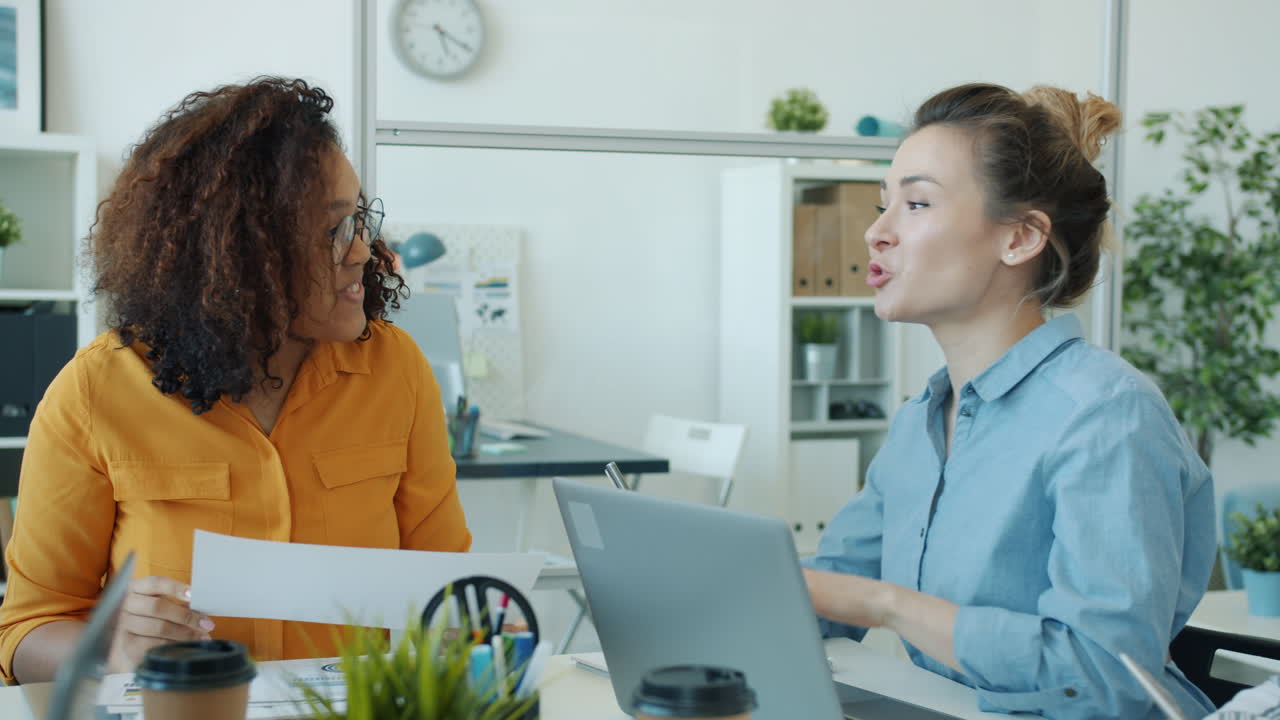 Two Women in an Office Meeting