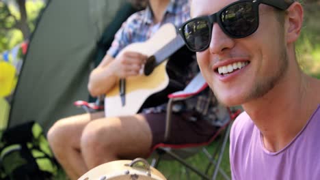 hipster friends singing and playing music