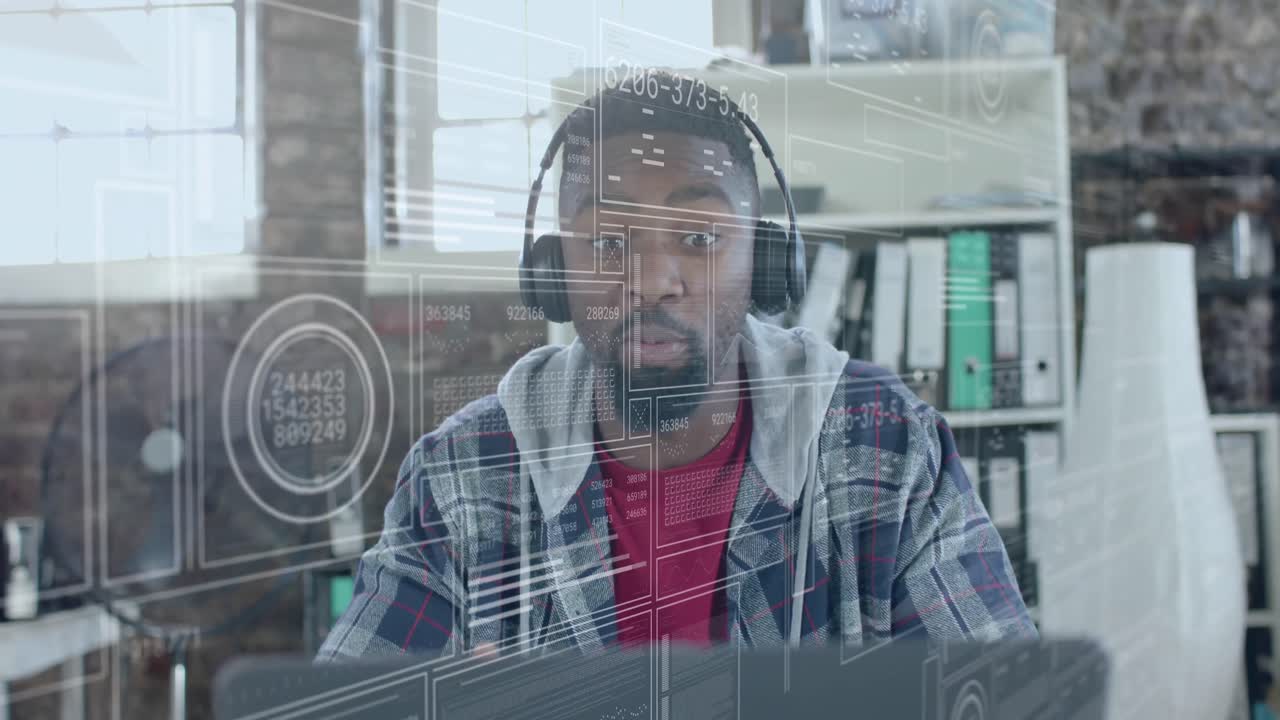 Animation of data processing over happy african american businessman with headphones in office