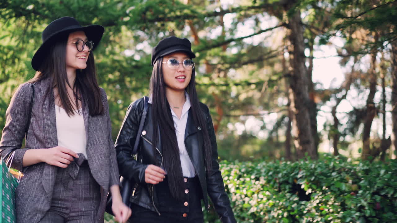 Two Women Friends Walking in a Park