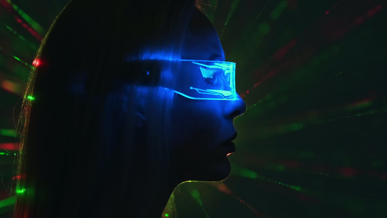 The female in a futuristic glasses on a color rays background
