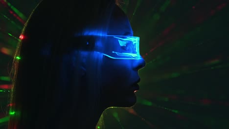 the female in a futuristic glasses on a color rays background