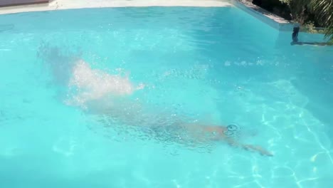 Handsome-man-diving-in-the-pool