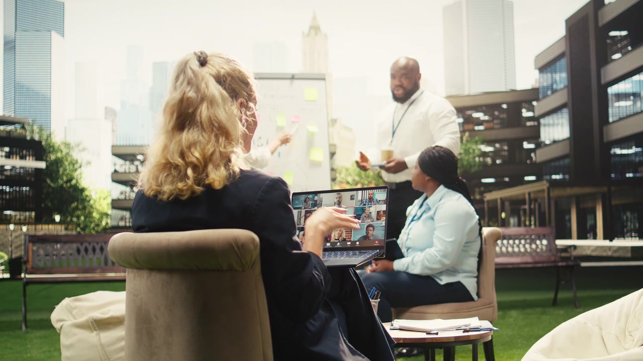 Business Team Having Hybrid Meeting on Outdoor Office Terrace
