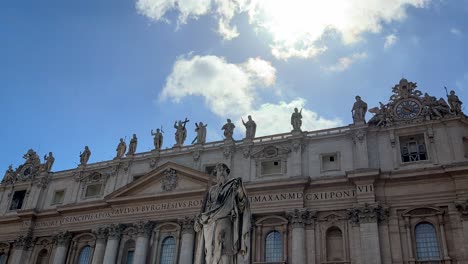 low angle view of saint pete's square inside vatican city, blue sky with statues