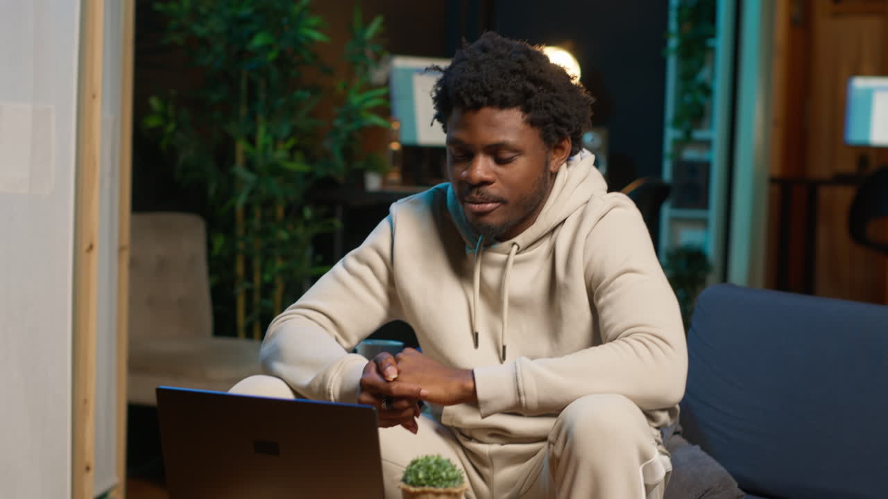 Newly hired man beginning training session on remote video call connection, meeting online with trainer colleague and learning how to solve daily tasks. Male worker nervous about new job. Camera A.