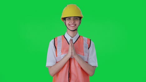 Happy-Indian-female-architect-doing-Namaste-Green-screen