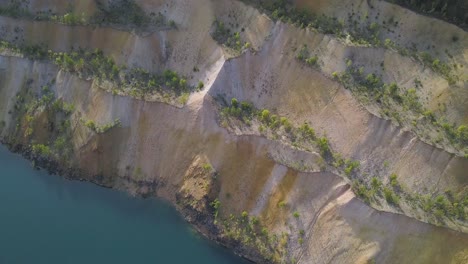 aerial view of a quarry with a lake