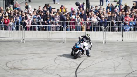 motorcycle stunt show with crowd