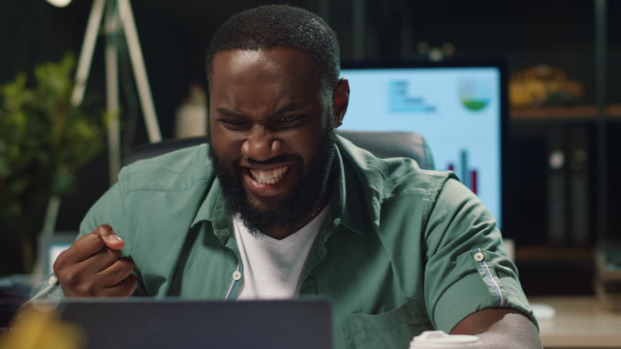 Closeup smiling african american business man enjoying success in hipster office
