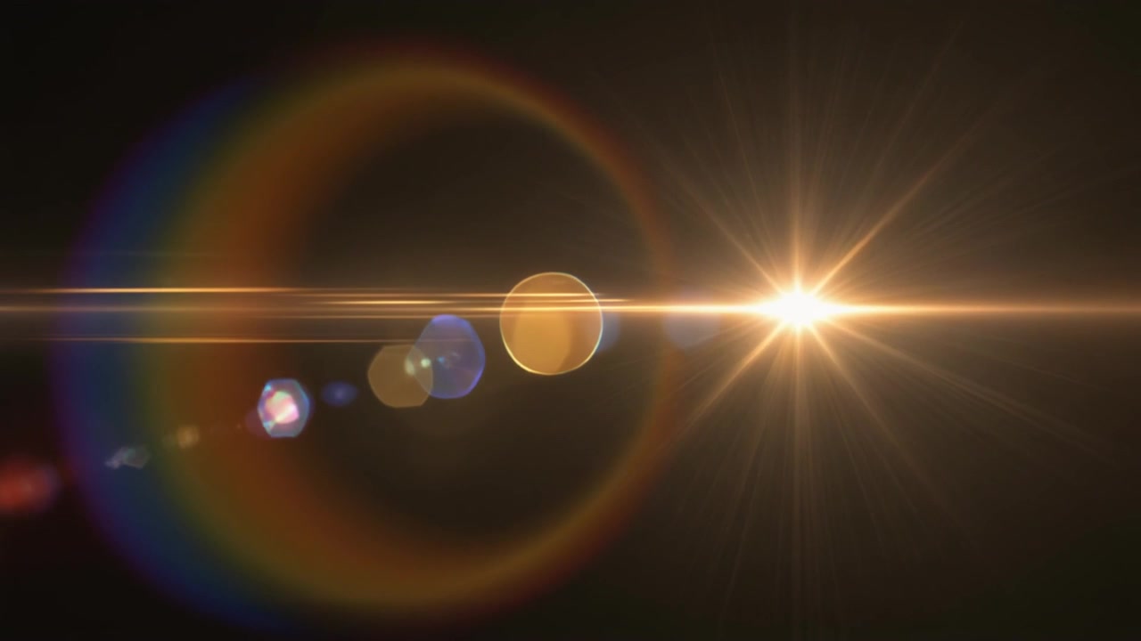 Golden Lens Flare Effect on Black Background