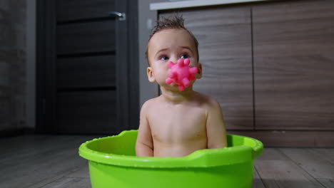 baby having fun in a bathtub