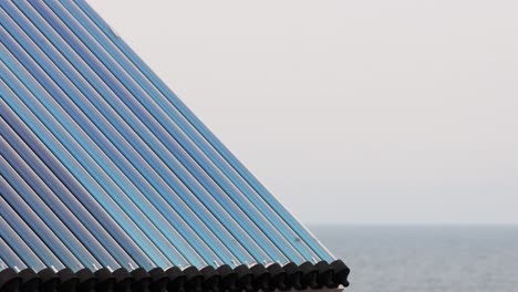 solar water heating system installed on house roof by the sea coast