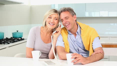 Couple-talking-on-the-telephone-together