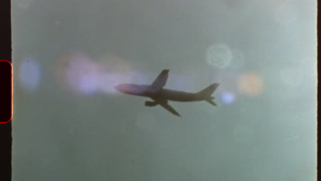 filmed on super 8 film - passenger airplane soaring through pristine blue sky, capturing nostalgic journey with authentic 8 mm film aesthetic and distinctive light leaks