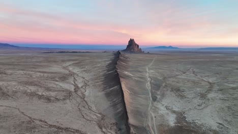 ship rock landform in new mexico at sunset - drone shot