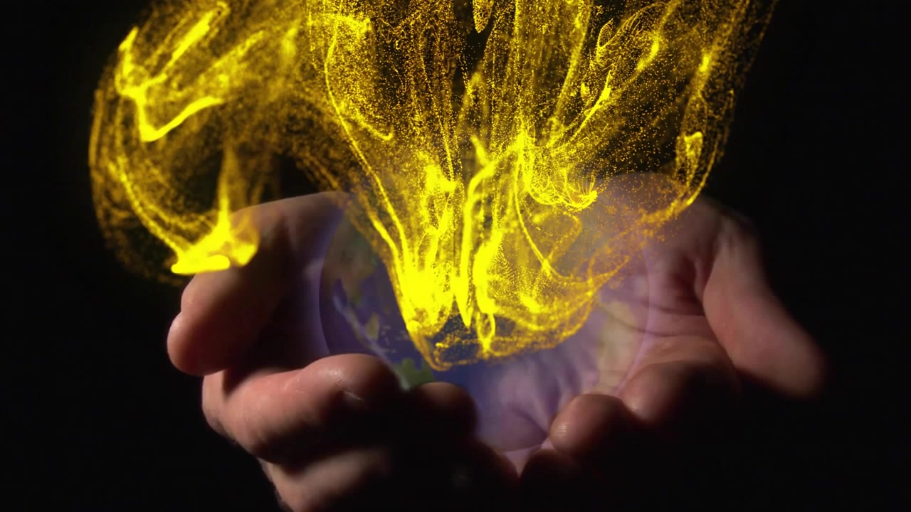 Hands entering holding rotating mini globe while golden streams cascading into vortex showing flow