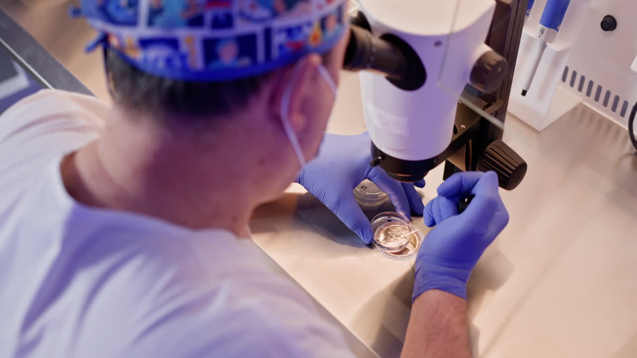 Scientist using microscope in a laboratory