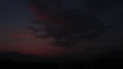 moving time lapse of sunset over the kathmandu valley. video turns to complete black.