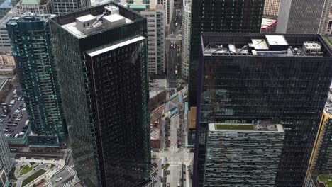 aerial high above seattle showcasing how small the streets are beneath the skyscrapers