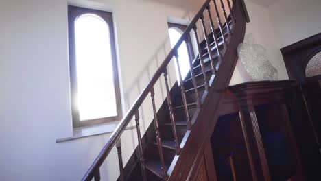 bright sunlight and lens flare on a wooden indoor staircase