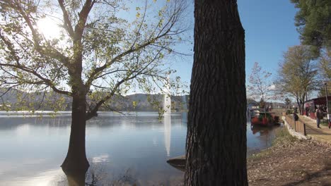 View-to-Artificial-lake-from-path-for-leisure-walks-in-Grand-Park-in-Tirana,-Albania---Wide-Pull-out-shot