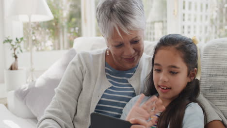 happy girl using smartphone with granny having video chat waving at family sharing vacation weekend with grandmother chatting on mobile phone relaxing at home with granddaughter 4k