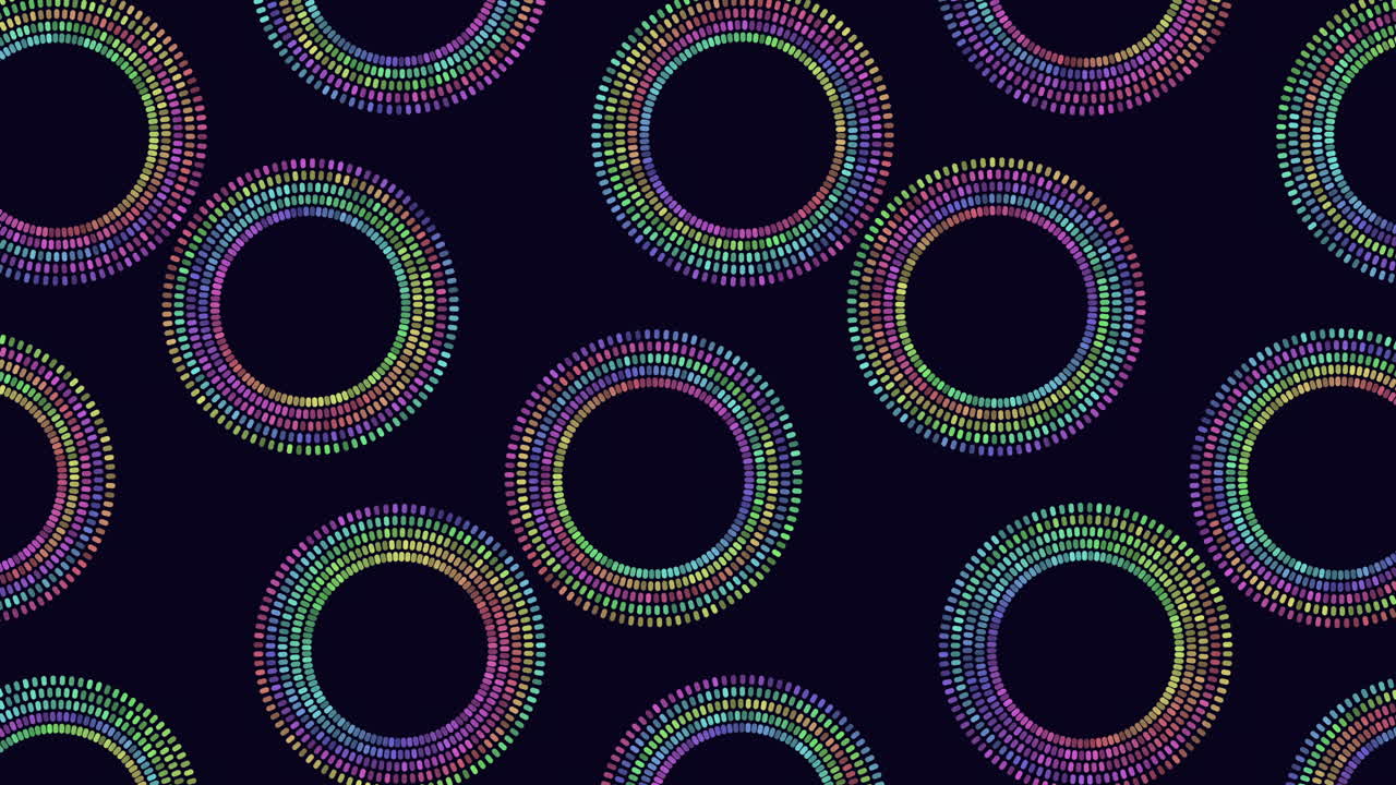 Vibrant spiraling pattern of circles on a black background features shades of purple, pink, and blue. The concentric arrangement radiates outwards, with diminishing circle sizes towards the center