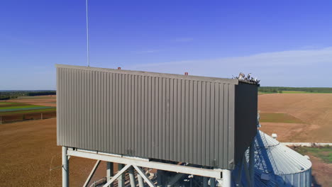 granary grain elevators. metal tanks for the storage crop. large bins for farming.