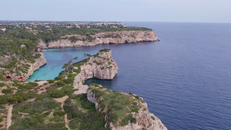 panoramic shot of s'almonia bay mallorca with no boats and people, aerial