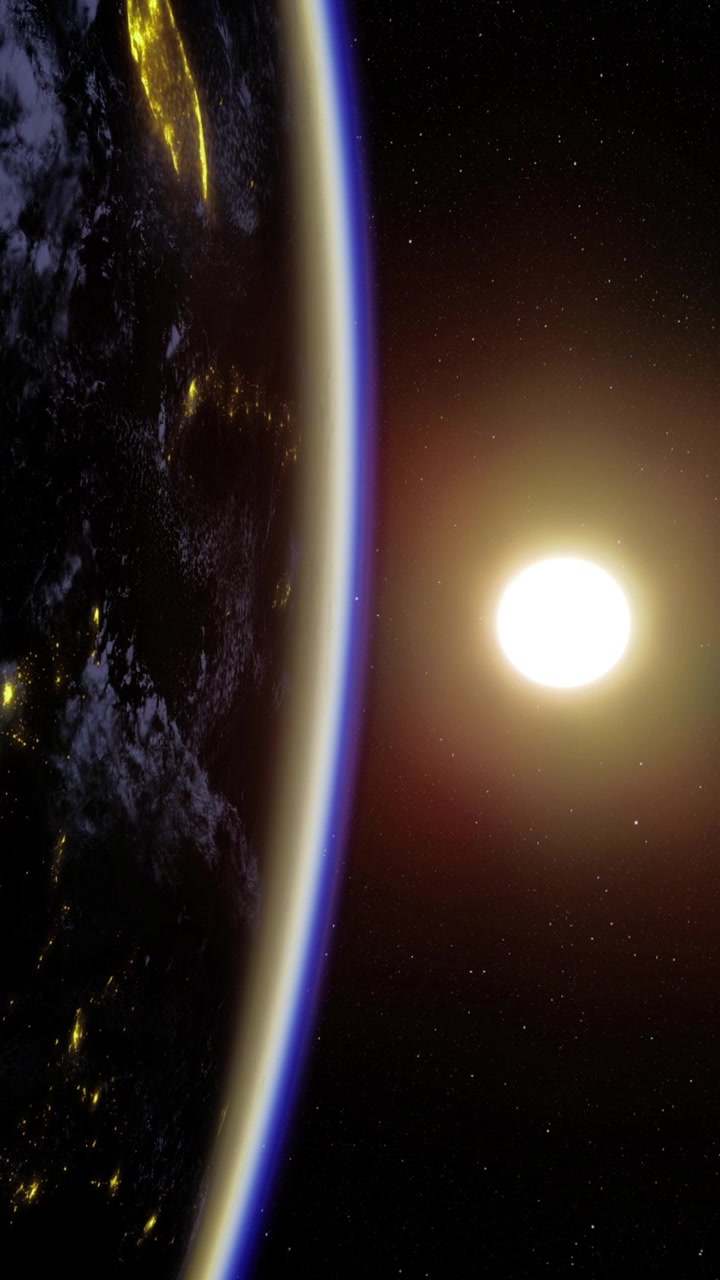 Sunrise over earth revealing vibrant city lights from space