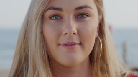 portrait beautiful blonde woman smiling outdoors at seaside happy lifestyle