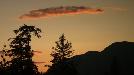 TIMELAPSE:-Golden-sunset-with-trees-and-hills-in-Montana