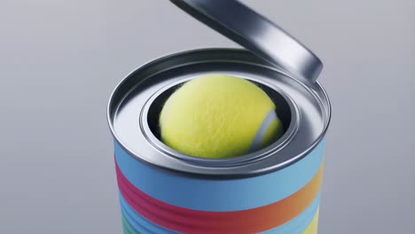 a tennis ball inside an open can
