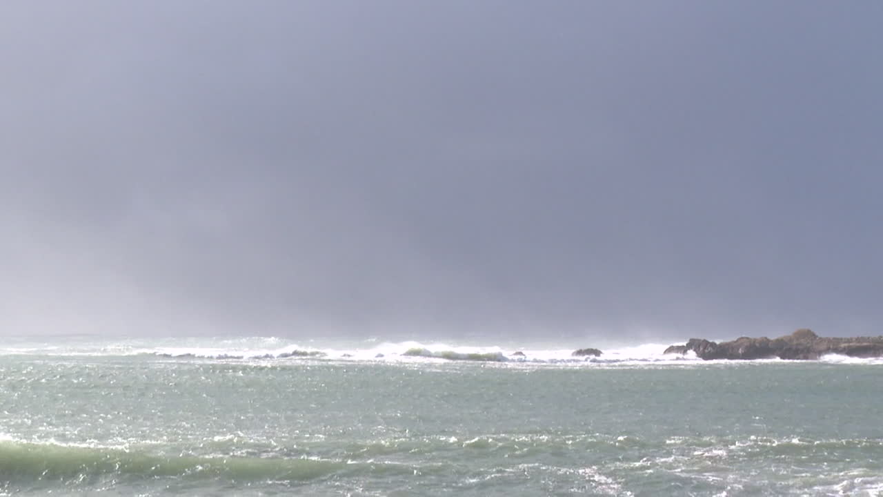 Ocean Waves and Rocks on a Cloudy Day