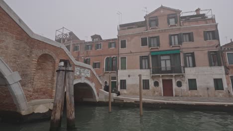 venice, italy, 16 october 2022: first morning mist, foggy weather typical of fall autumn season in venezia