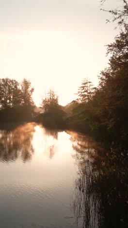 sunrise over a misty river