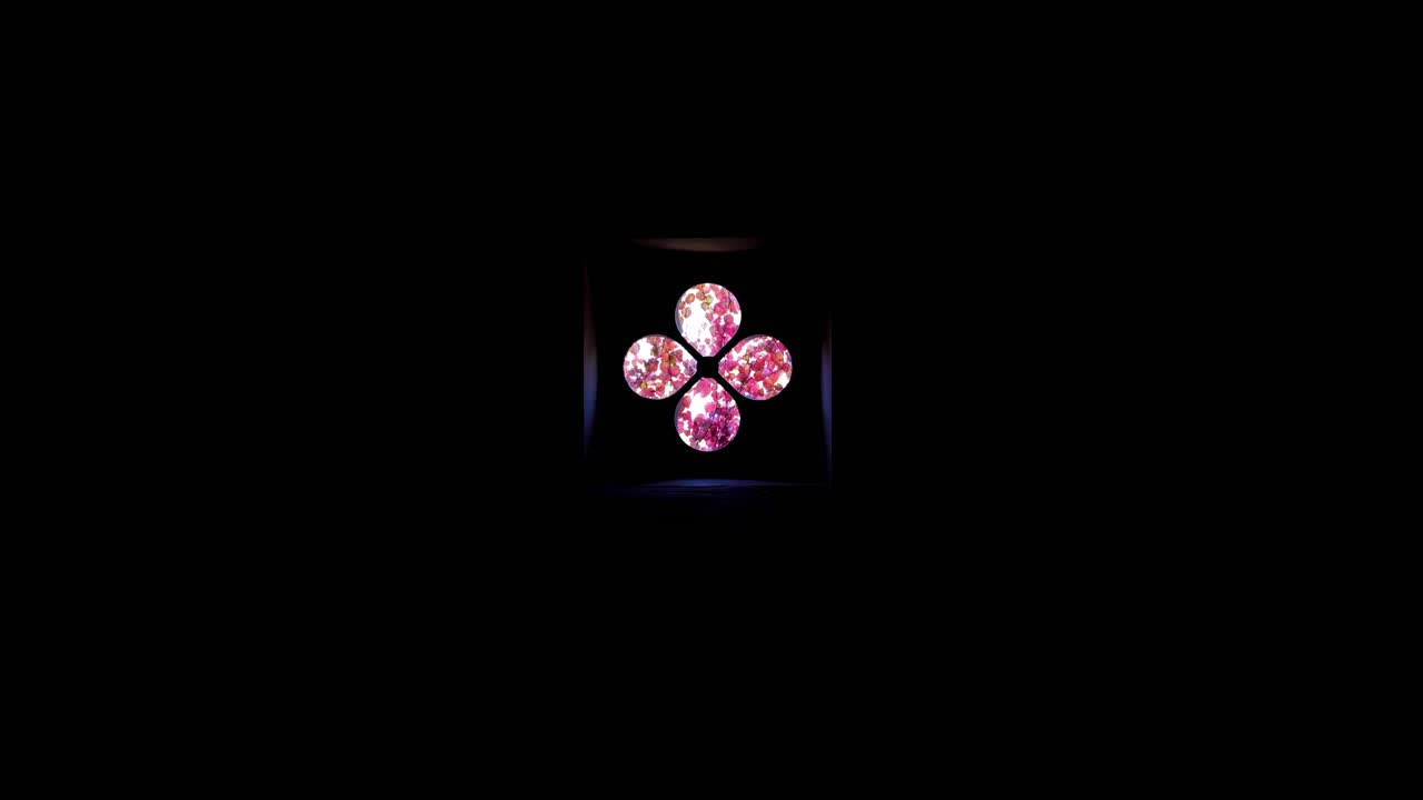 In a dark attic, a cloverleaf window, walk towards this window to see a magnificent pink and orange tree outside