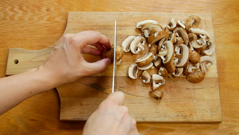 home cook slices up some mushrooms