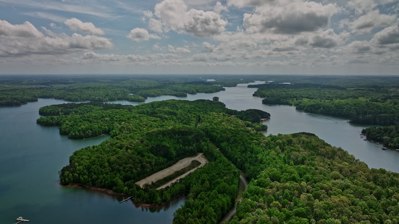 Lake Hartwell Georgia Aerial v4 landscape of Gumlog and Tugaloo State Park covered in lush green forest and water reservoir bordering Georgia and South Carolina - Shot with Mavic 3 Cine - April 2022